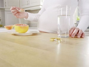 Pregnant Woman with Grapefruit and Supplements